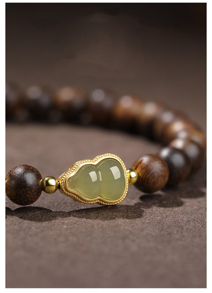 Agarwood bracelet and Hetian jade gourd bracelet