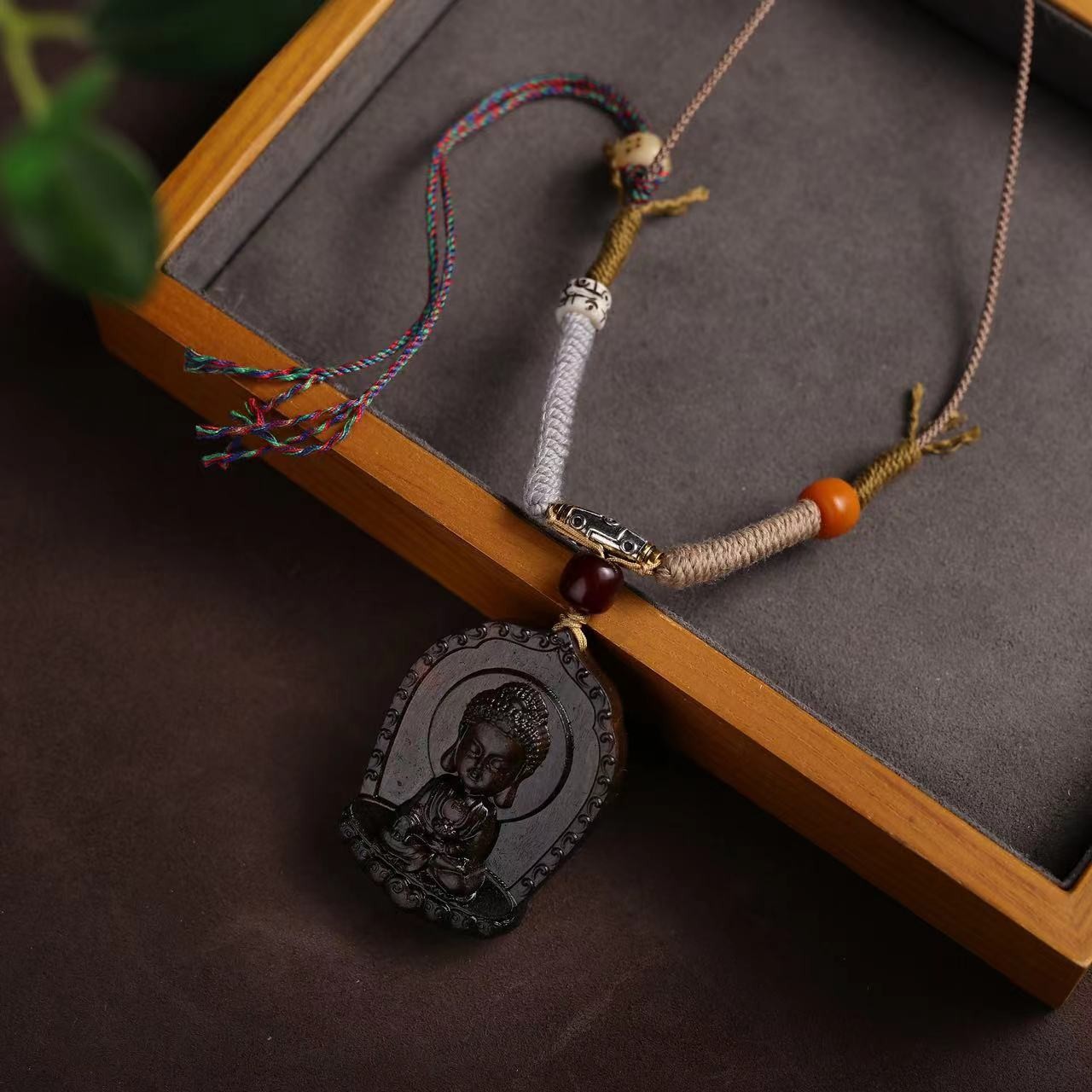 Tibetan hand-woven rope with baby Buddha pendant and amulet lanyard